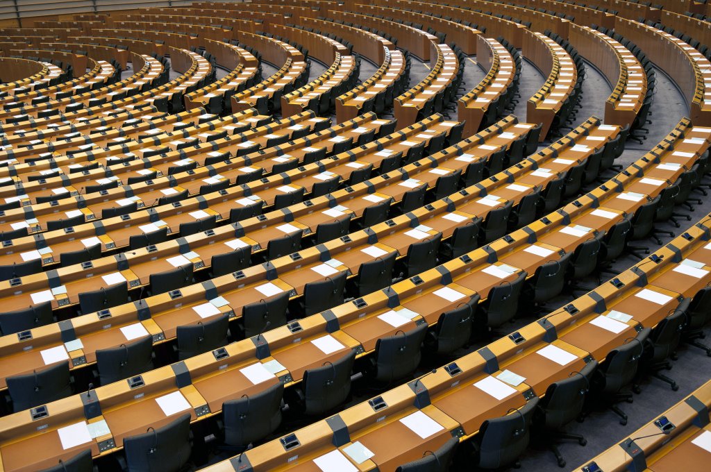 Rows of desks in a conference room.