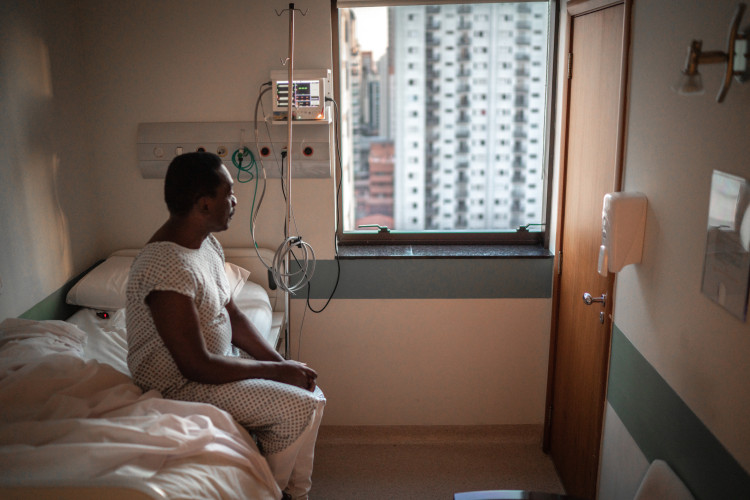 senior-patient-looking-through-window-at-hospital.jpg